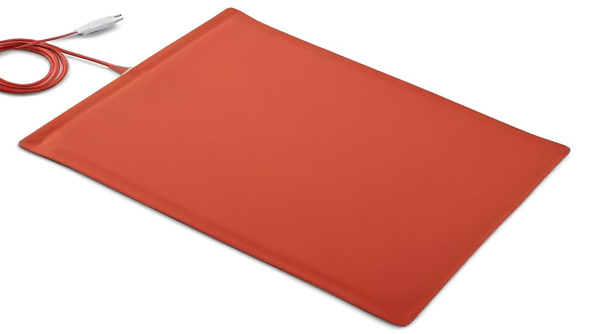 A red silicone rubber heating mat with its twin lead coiled beside it.